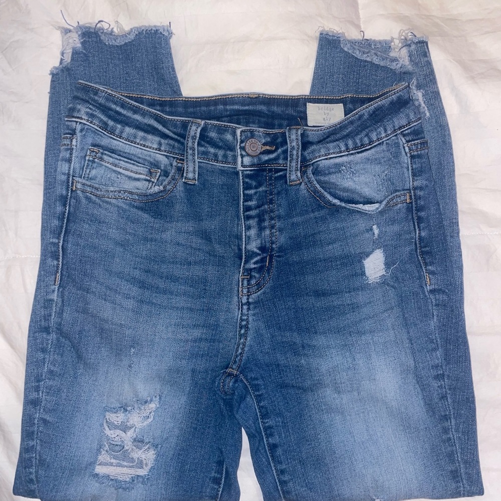 Distressed Mid-rise Skinny Jeans.